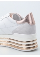 Zapatillas de deporte de tacón bajo cuñas de Hogan en piel blanca