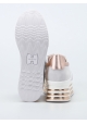 Zapatillas de deporte de tacón bajo cuñas de Hogan en piel blanca